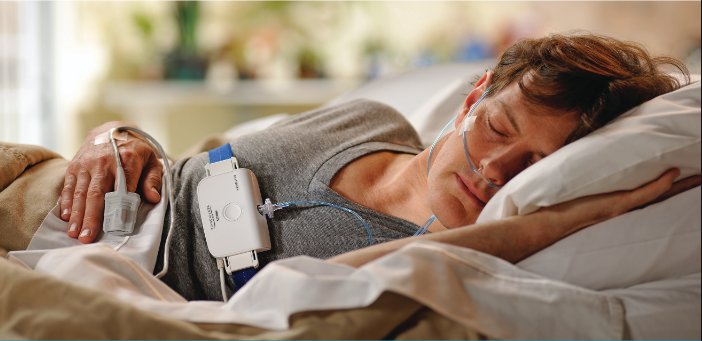 Patient sleeping at home with a home sleep study device